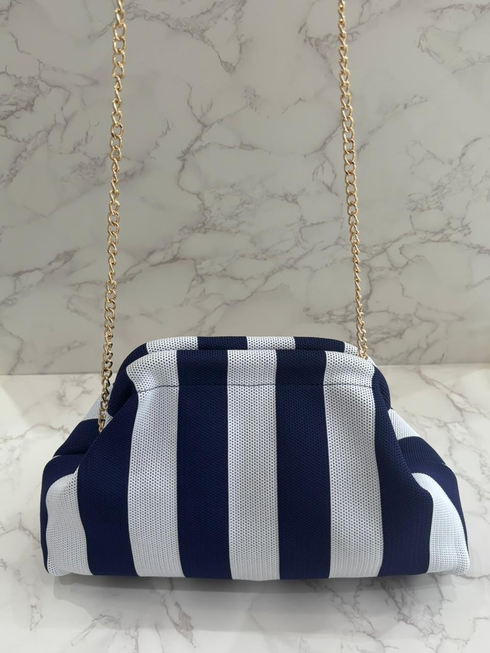 Bolso clutch marino raya